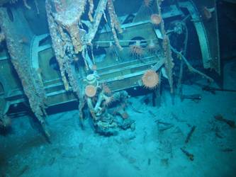 Large piece of machinery and hull section on seabed
